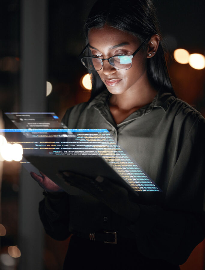 Woman, tablet and hologram at night in web design with dashboard, interface or hud display at the office. Female person, employee or developer working late on futuristic technology or code overlay
